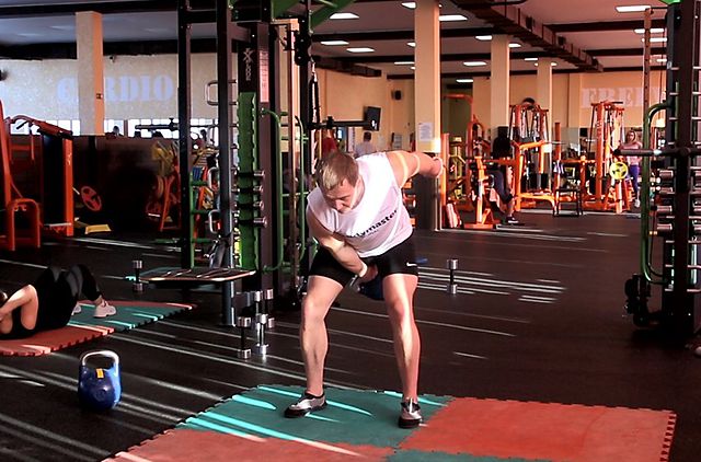 Photo of One-Arm Kettlebell Split Snatch exercise