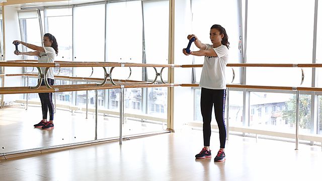 Photo of Spining the wheel with a dumbbell with bending exercise