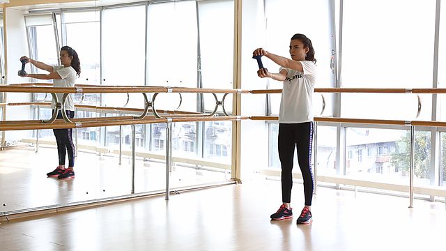 Photo of Spining the wheel with a dumbbell with bending exercise