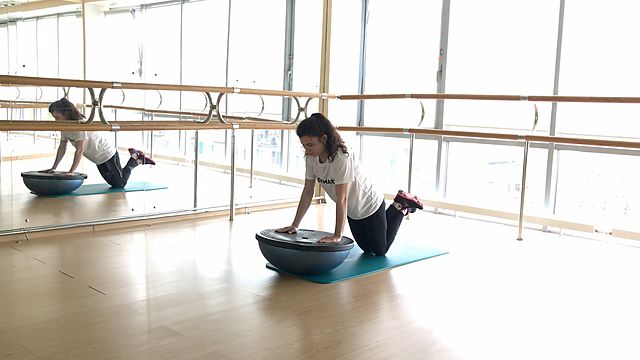 Photo of BOSU Down Push Up exercise