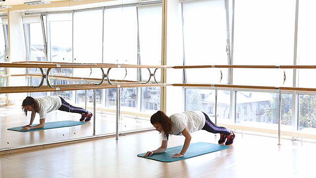 Photo of The move from plank into the push-up position exercise