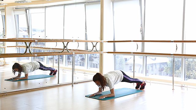 Photo of The move from plank into the push-up position exercise