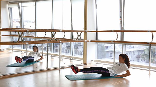 Photo of Folding legs and body in the middle position exercise