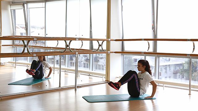 Photo of Folding legs and body in the middle position exercise