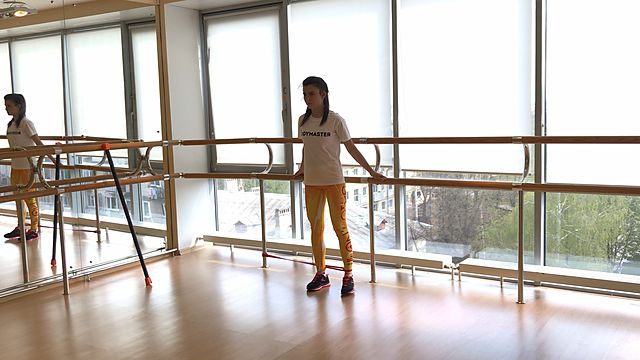 Photo of Leg side abduction with a rubber band exercise
