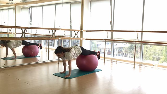 Photo of Stepping hands lying on a fitball exercise