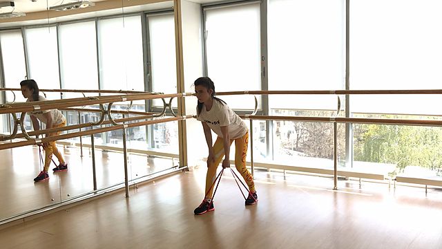 Photo of One-handed rubber band pull exercise