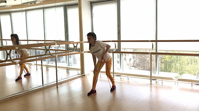 Photo of One-handed rubber band pull exercise