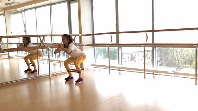 Photo of Walking in a squat position using a mini band exercise
