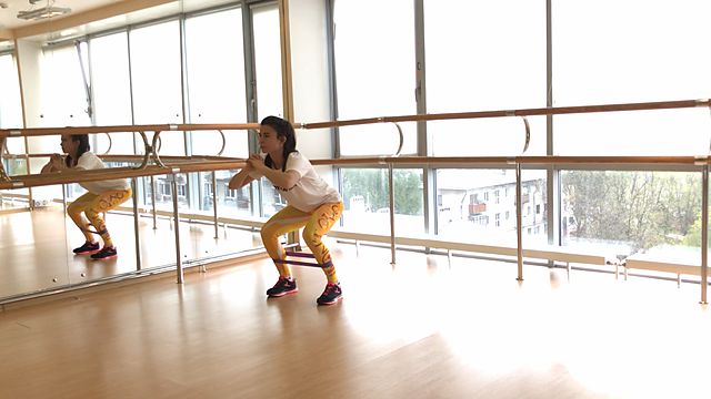 Photo of Walking in a squat position using a mini band exercise