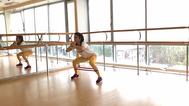 Photo of Walking in a squat position using a mini band exercise