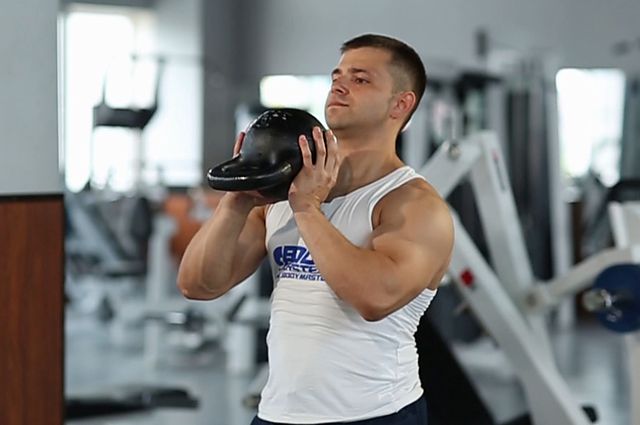 Photo of Open Palm Kettlebell Clean exercise