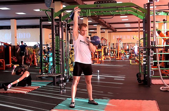 Photo of Alternating Kettlebell Press exercise