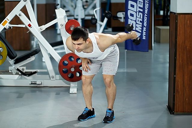 Photo of Standing Bent-Over One-Arm Dumbbell Triceps Extension  exercise