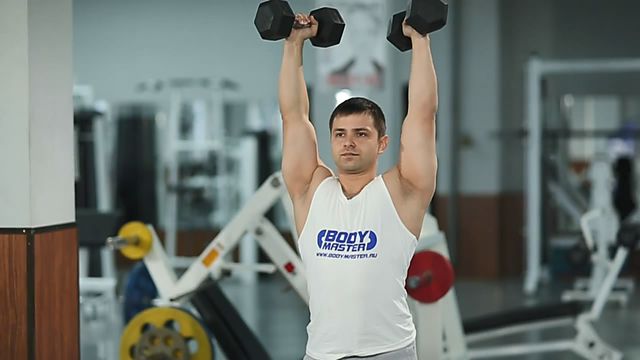 Photo of Standing Palms-In Dumbbell Press  exercise
