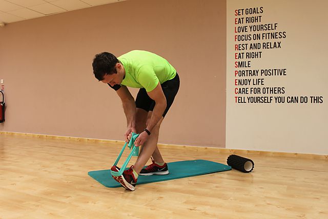 Photo of Standing Hamstring and Calf Stretch exercise