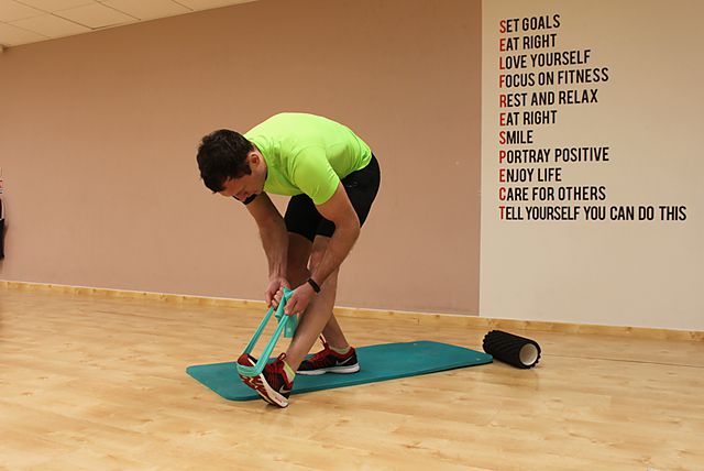 Photo of Standing Hamstring and Calf Stretch exercise