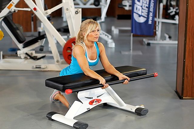 Photo of Palms-Up Barbell Wrist Curl Over A Bench exercise