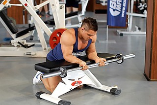 Palms-Up Barbell Wrist Curl Over A Bench