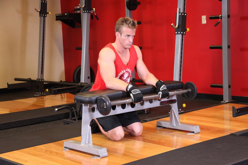 Exercise Palms-Down Wrist Curl Over A Bench