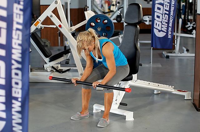 Photo of Seated Palms-Down Barbell Wrist Curl exercise