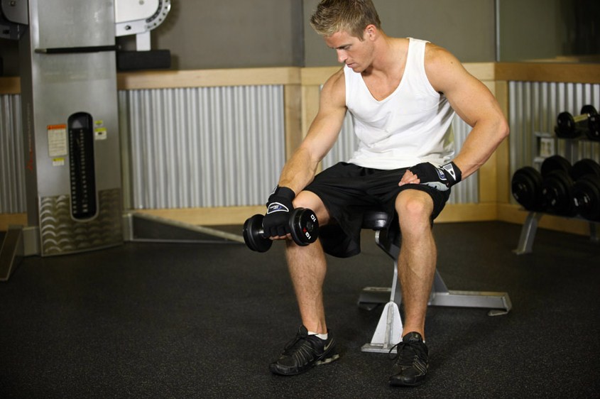 Exercise Seated One-Arm Dumbbell Palms-Down Wrist Curl 