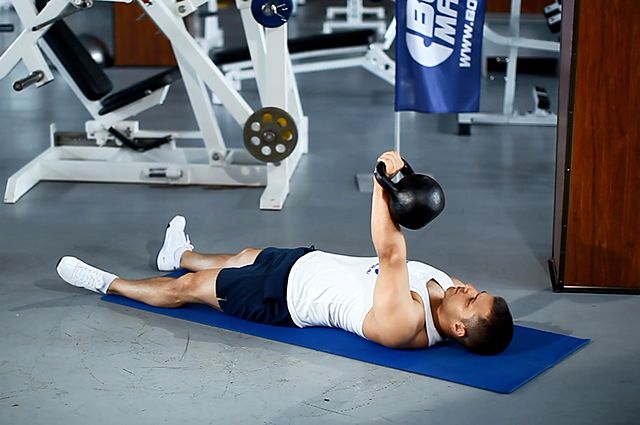 Photo of One-Arm Kettlebell Floor Press exercise