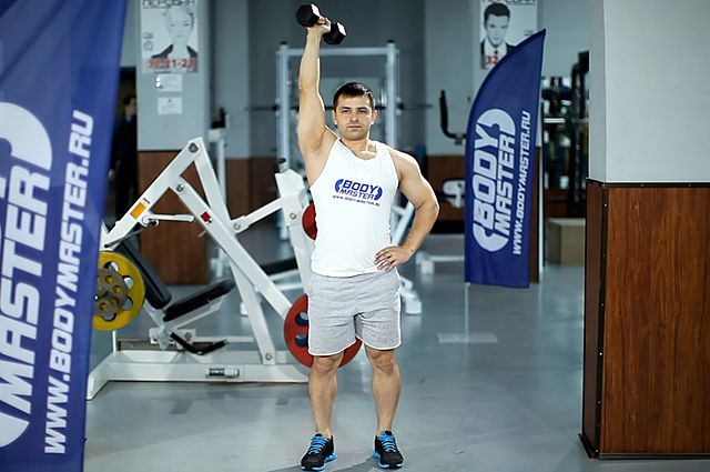 Photo of Standing One-Arm Dumbbell Triceps Extension exercise