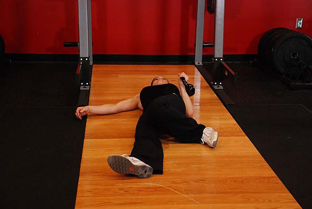 Photo of Extended Range One-Arm Kettlebell Floor Press  exercise