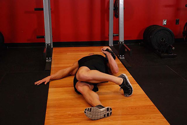 Photo of Extended Range One-Arm Kettlebell Floor Press  exercise
