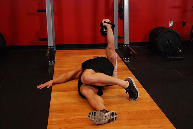 Photo of Extended Range One-Arm Kettlebell Floor Press  exercise