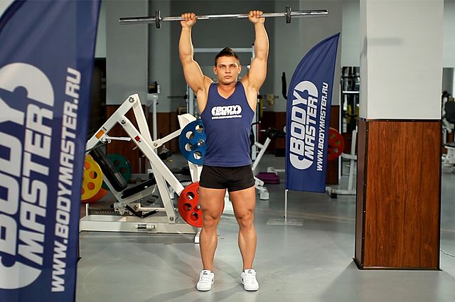 Photo of Standing Front Barbell Raise Over Head  exercise