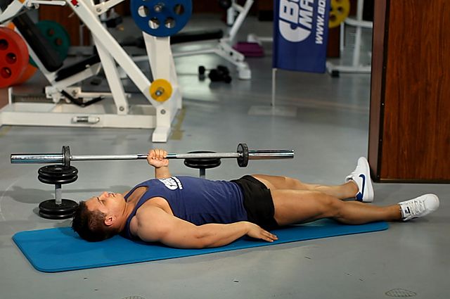 Photo of One Arm Floor Press  exercise