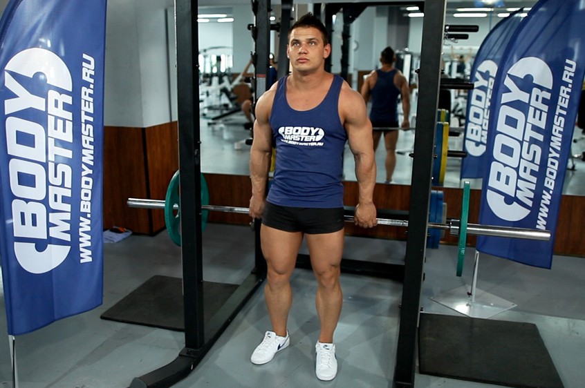 Exercise Barbell Shrug Behind The Back