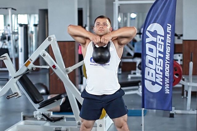 Photo of Kettlebell Sumo High Pull exercise