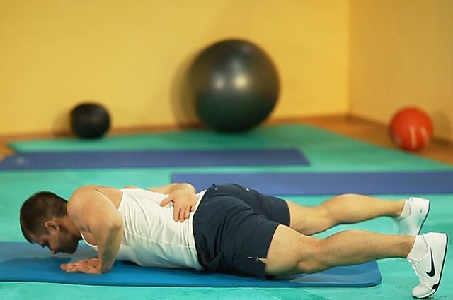 Photo of Single-Arm Push-Up exercise