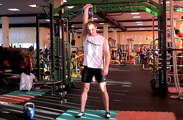 Photo of One-Arm Kettlebell Military Press To The Side exercise