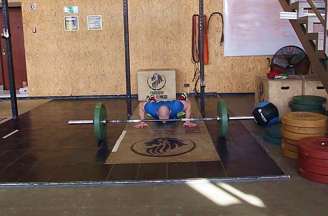 Photo of Burpee Over Barbell exercise
