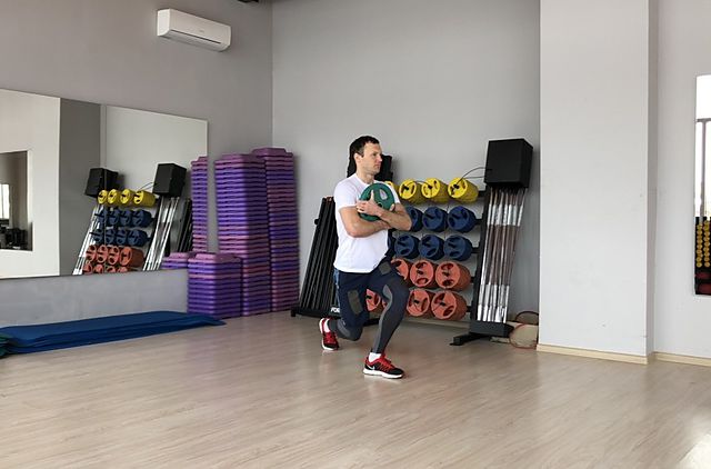 Photo of Kettlebell Curtsy Lunge exercise