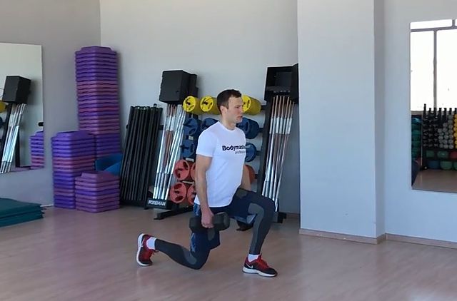 Photo of Dumbbell Walking Lunge exercise