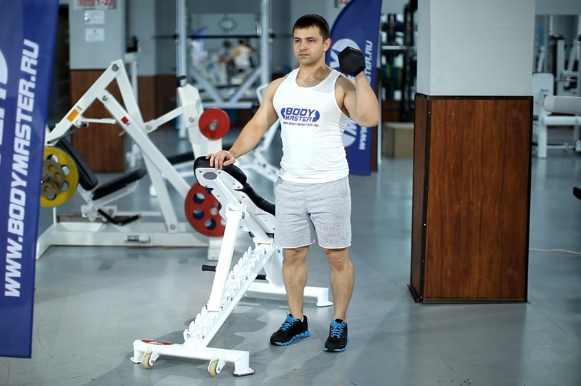 Exercise Standing Palm-In One-Arm Dumbbell Press