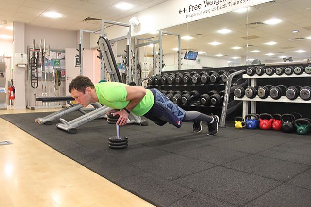 Photo of Close-Grip Push-Up off of a Dumbbell exercise