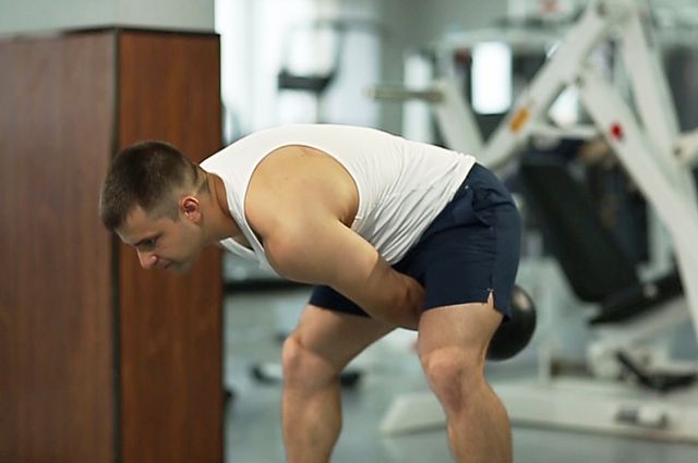 Photo of Kettlebell Pass Between The Legs exercise