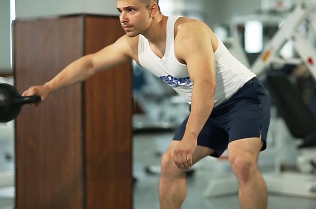 Photo of Kettlebell Pass Between The Legs exercise